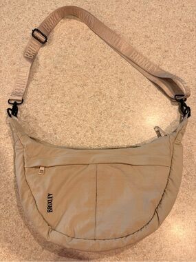 Brixley Beige Crescent Shoulder Bag with Adjustable Branded Strap